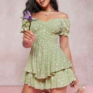 Beautiful sage floral romper dress with a bow that ties in the back!